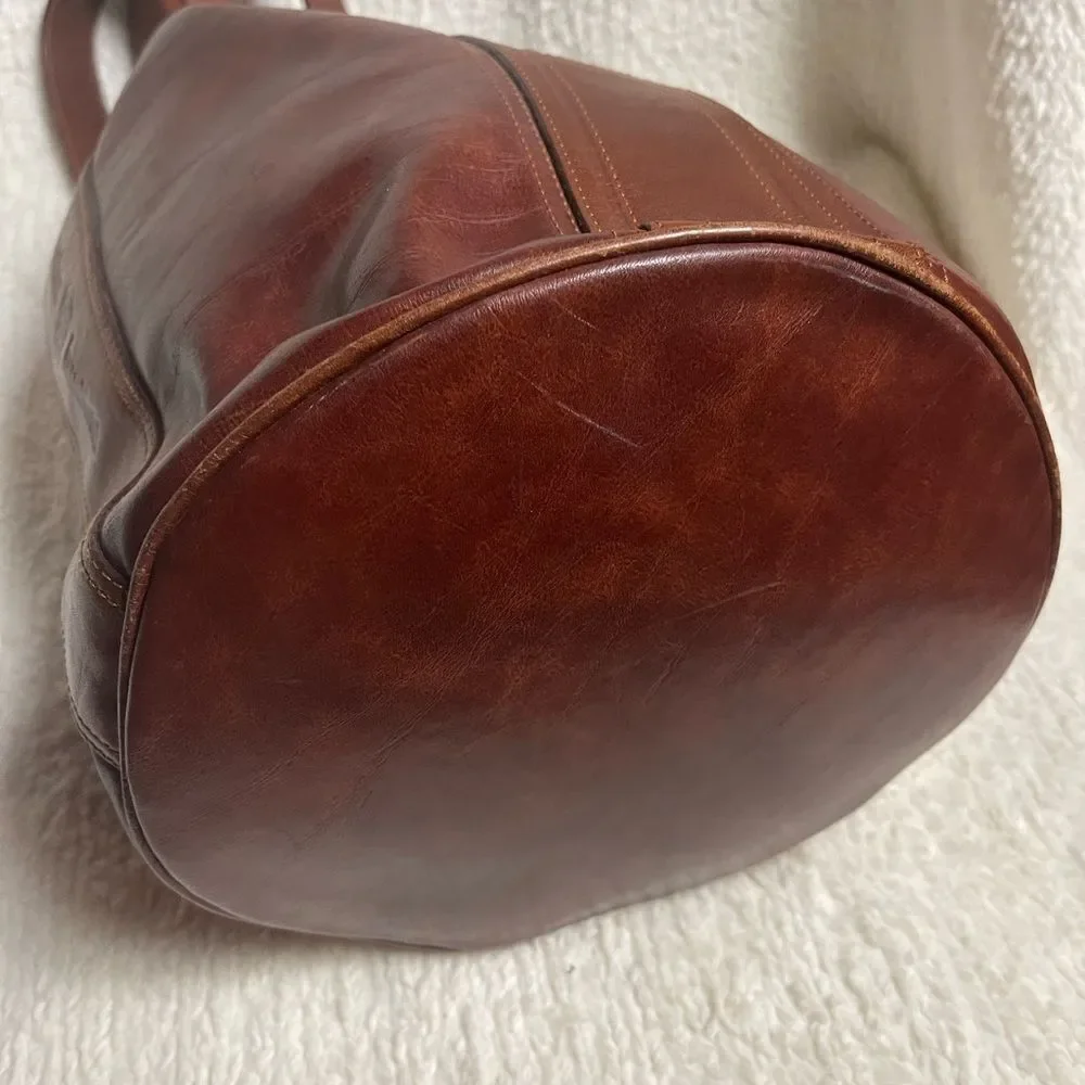 Fortune Duck vintage leather Brown sling back bucket style bag.
